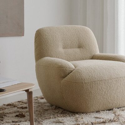 Sits Uma Armchair Upholstered in Fabric or Leather